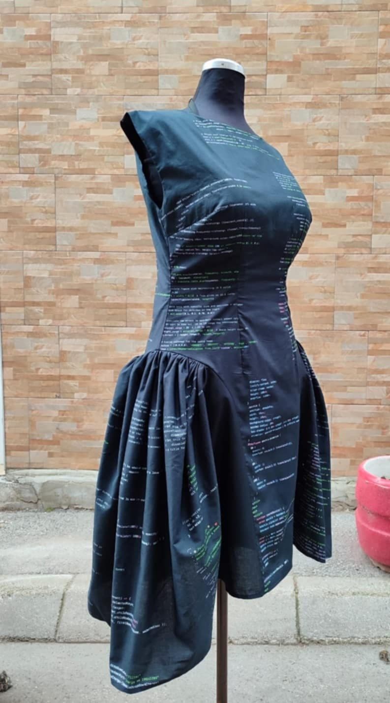A custom code-print dress with a dropped waist and full skirt