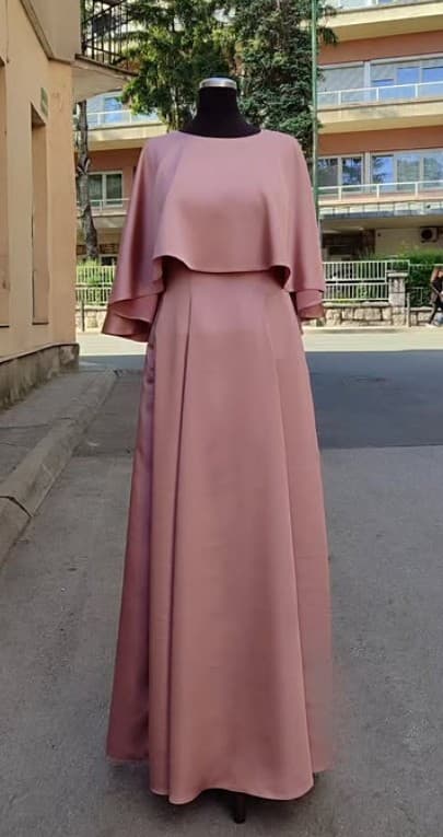 A custom dusty-rose satin gown with a soft capelet overlay — a modest formal silhouette that can conceal nursing access