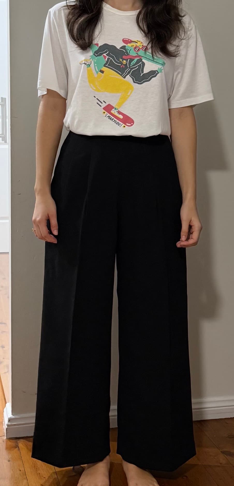 Dana wearing her custom made black wide-leg pants, sewn to her measurements by MadeApt