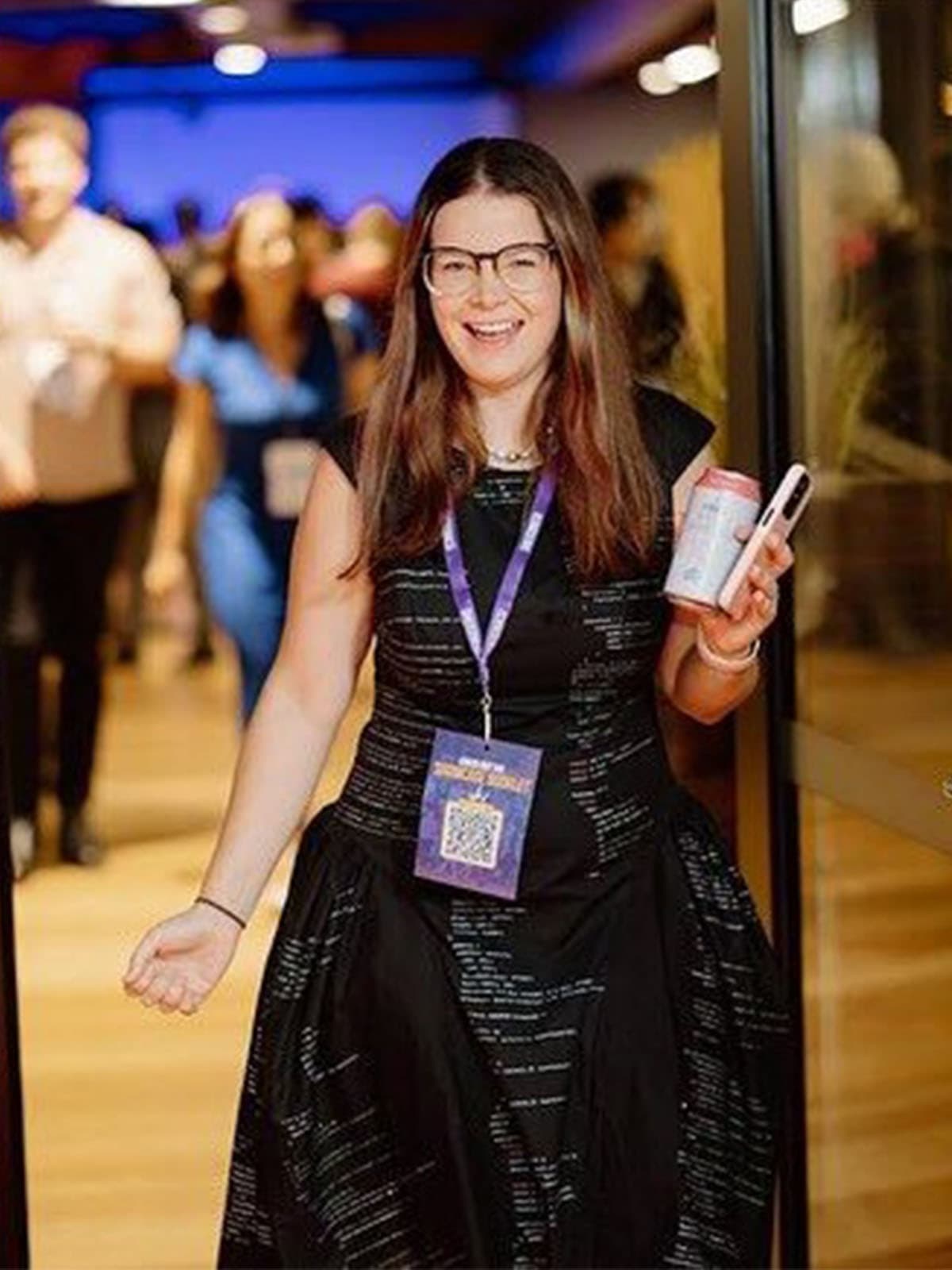 The same custom code-print dress, sewn by a real tailor and worn on stage