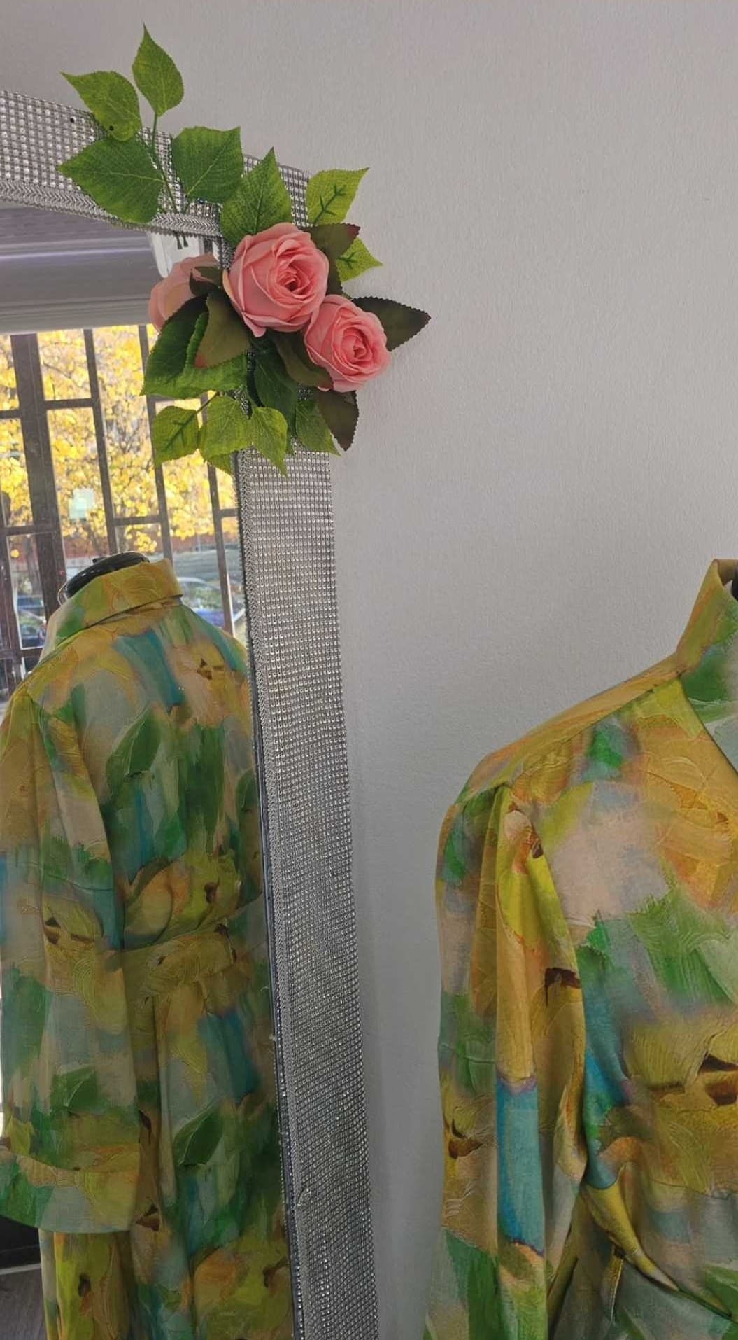 The silk shirt dress on a form beside a mirror in the Sarajevo atelier